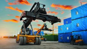 forklift working in the container cargo yard port loading=